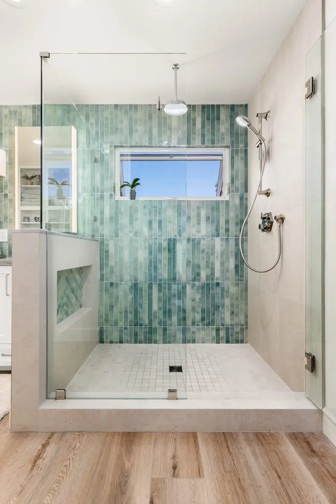 El Cajon master bathroom with herringbone tile and gold finishes