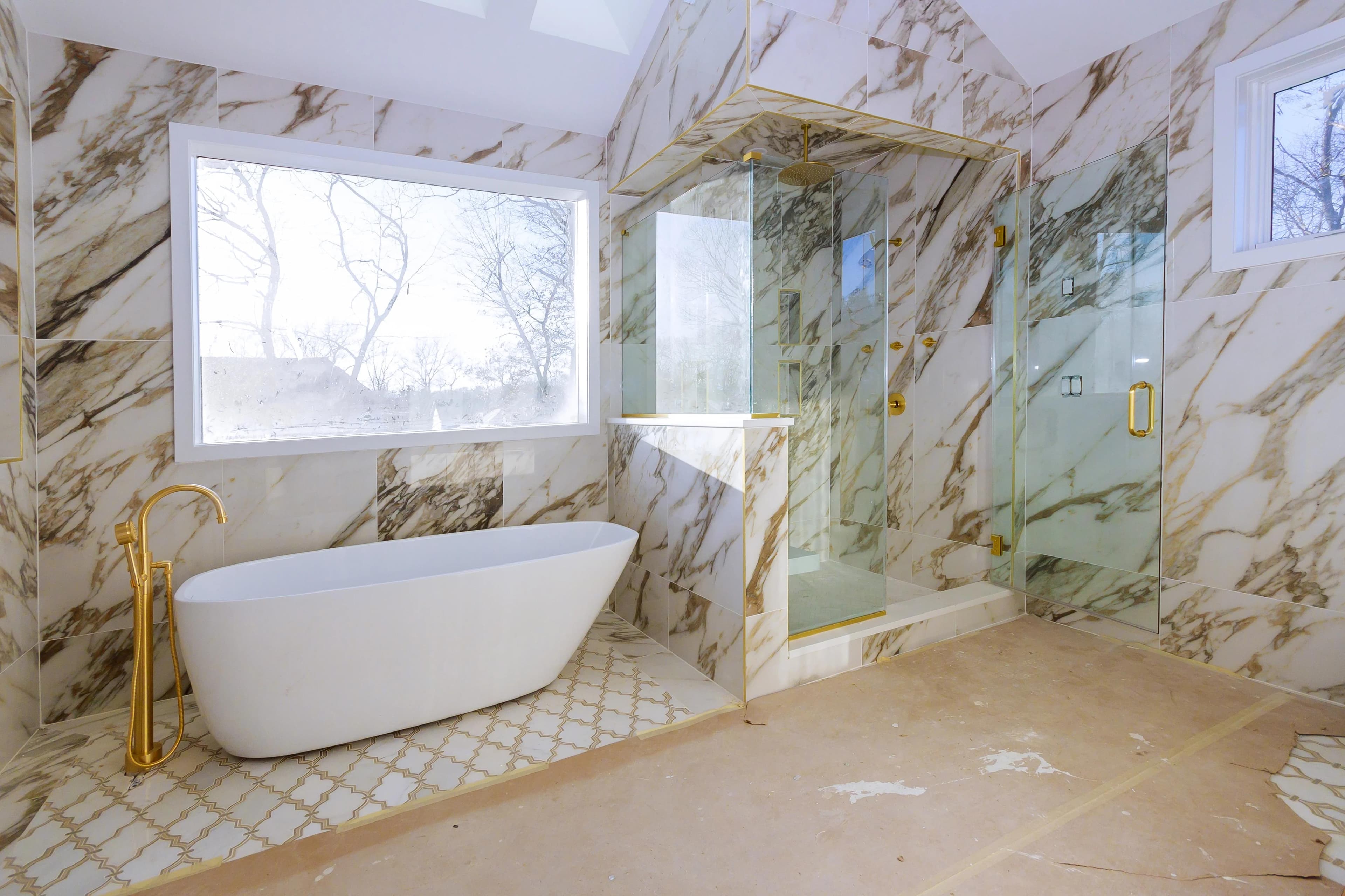 Remodeled San Diego master bathroom with a frameless glass walk-in shower and double vanity