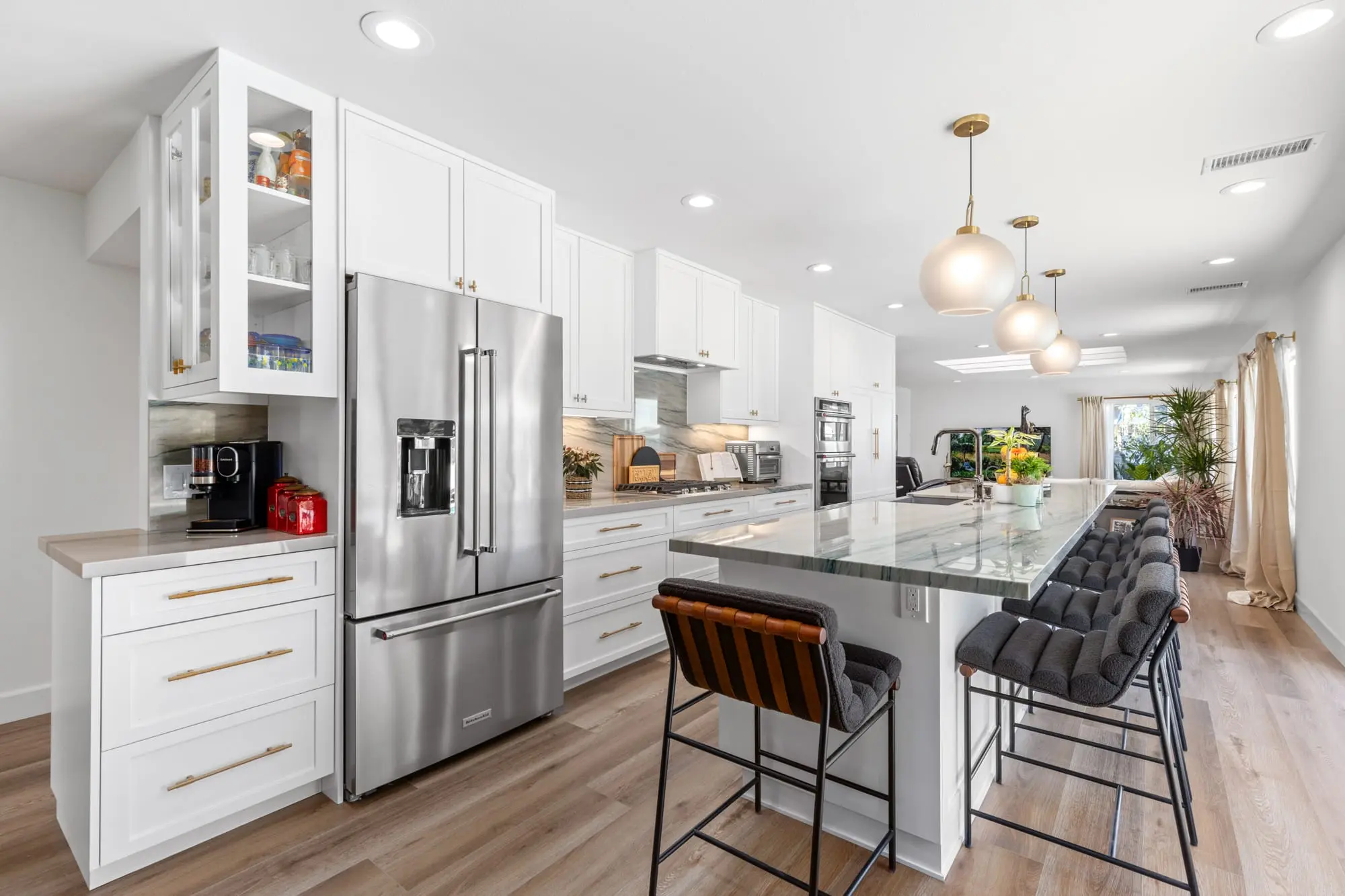 Modern kitchen with marble island after Tierrasanta remodel