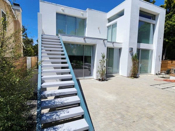 Water intrusion repair project in Del Mar featuring updated second floor deck and patio area