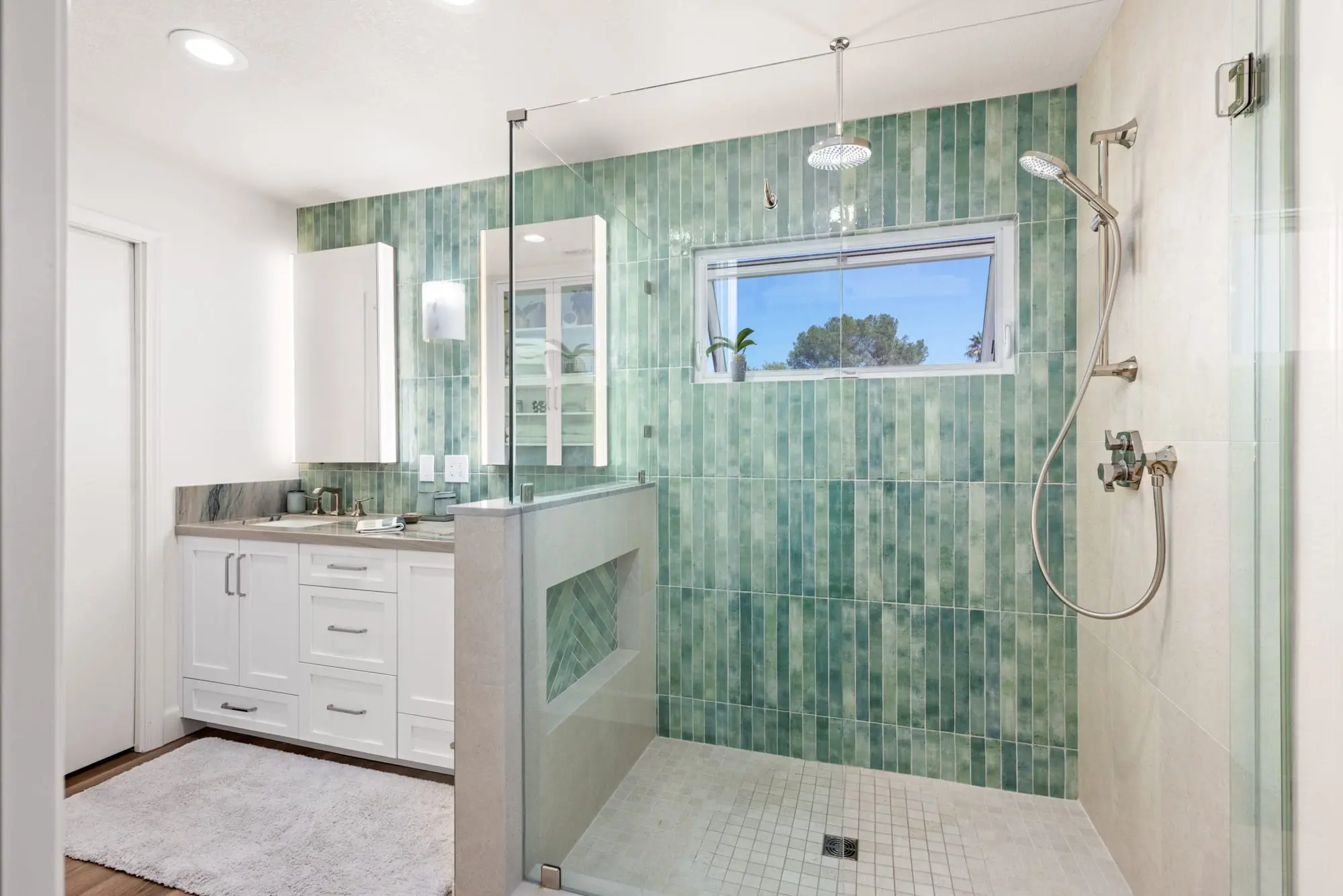 Master bath remodeling with green subway tiles and rain showerhead by Teknik