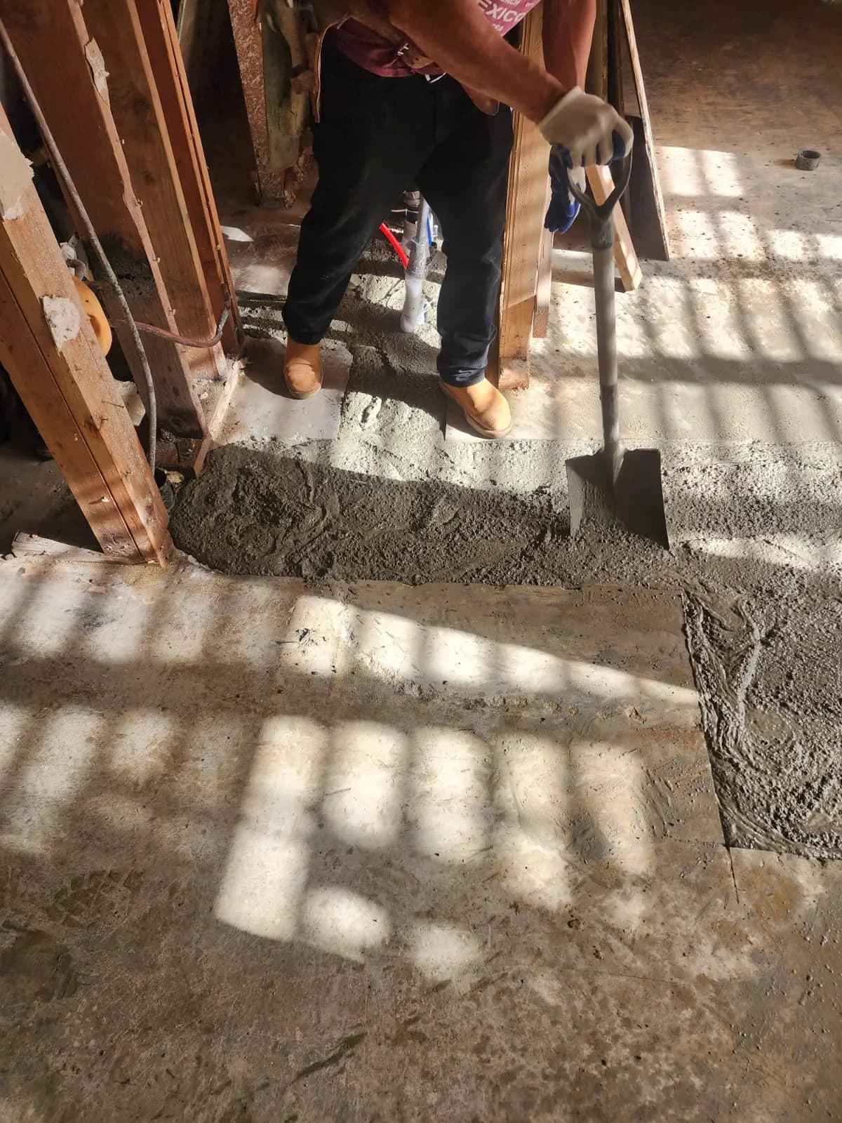 Fresh concrete poured back over the new lines