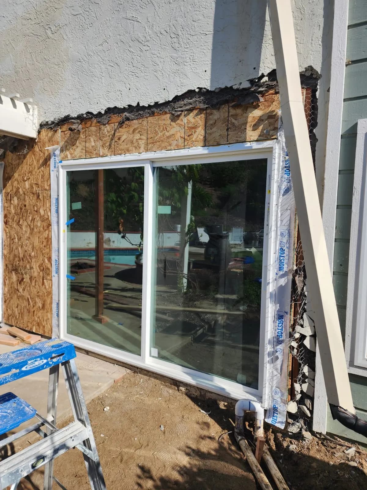 A new sliding door framed into the back wall