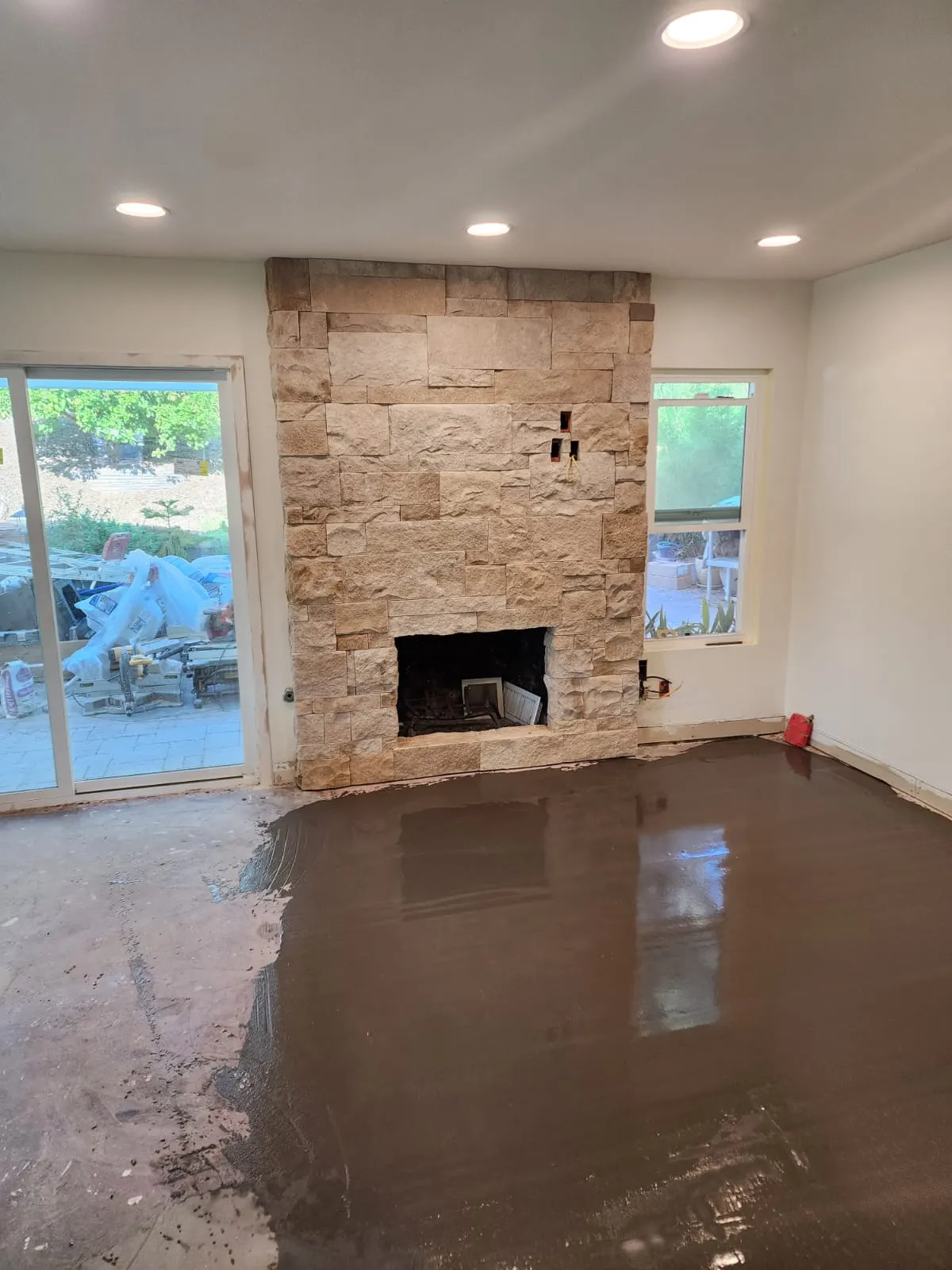 Stacked stone going up on the fireplace