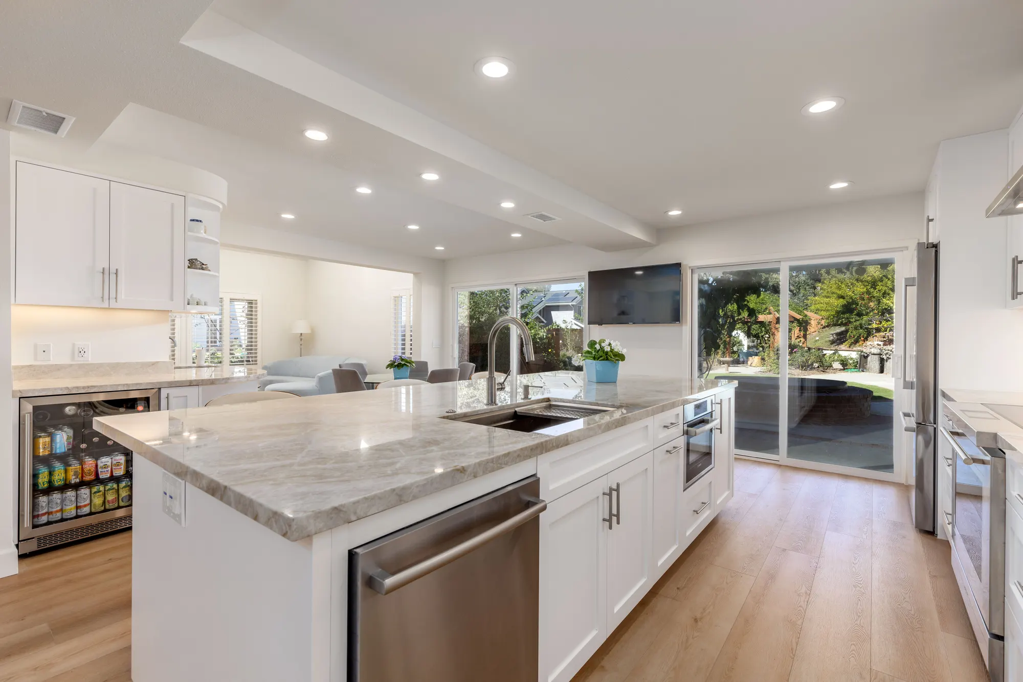 Kitchen island sink facing the family room, from a Teknik remodel in nearby Rancho Peñasquitos
