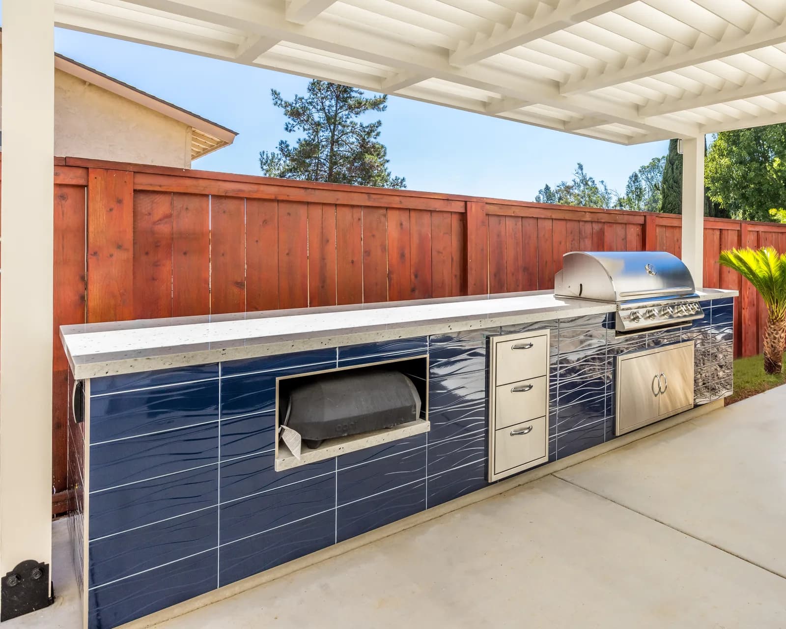 Built-in blue outdoor kitchen and entertaining patio, Scripps Ranch remodel