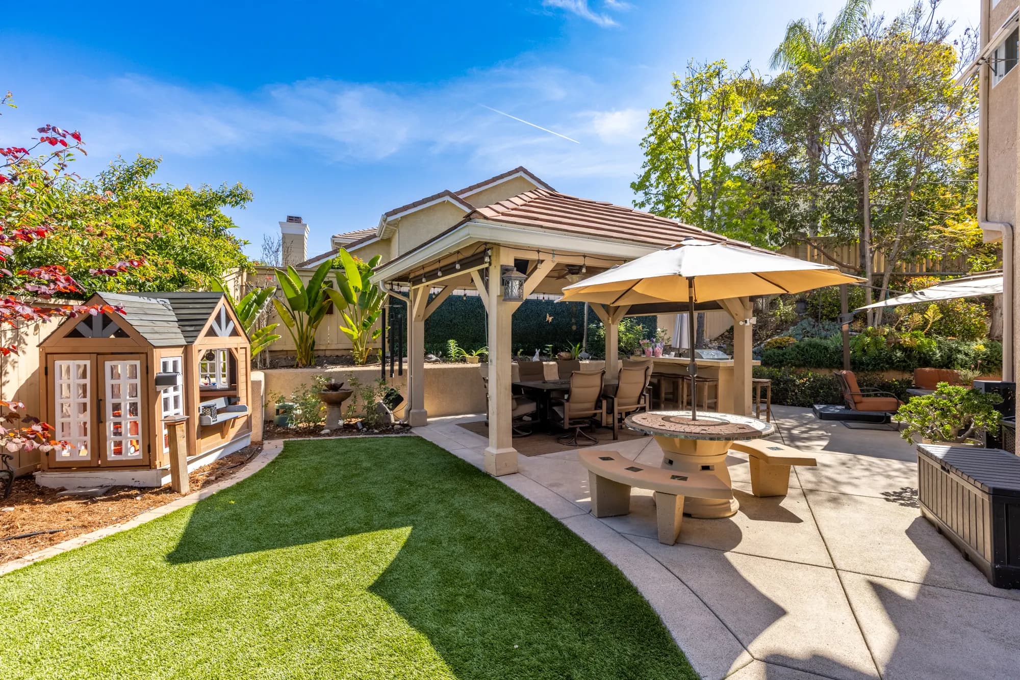 Backyard with a covered gazebo, lawn and outdoor dining in Tierrasanta