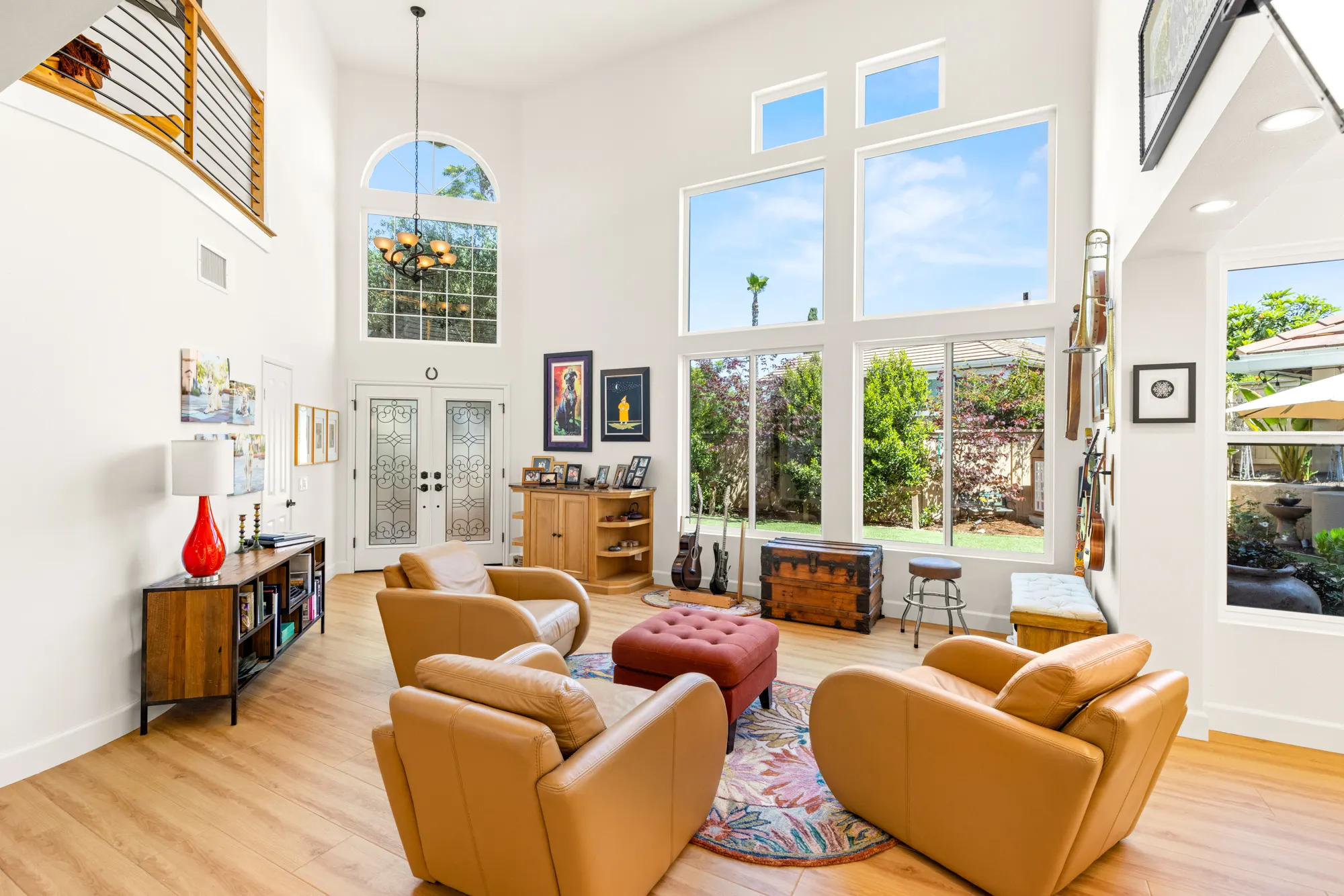 Two-story great room with tall windows after a Teknik whole-house renovation in Tierrasanta